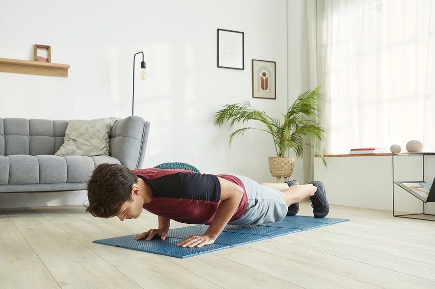 Stand in plank to work the muscles of the press and back